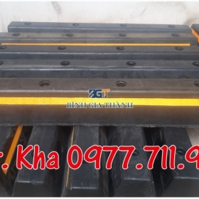 CỤC CHẶN LÙI BÁNH XE Ô TÔ